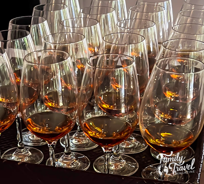 Samples of amber colored port wine in glasses on a tray