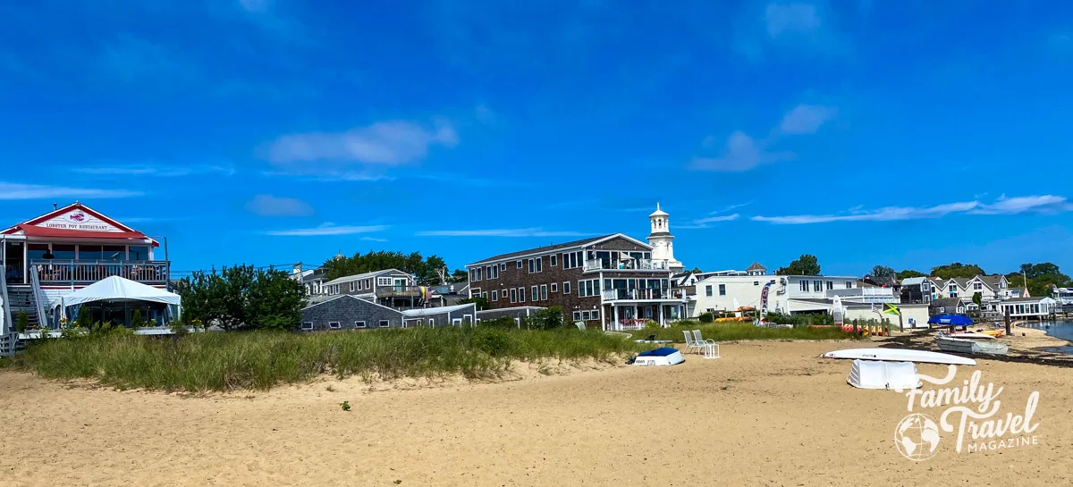 Provincetown shops and restaurants from the back with sand in the foreground - some of the best things to do in Provincetown.