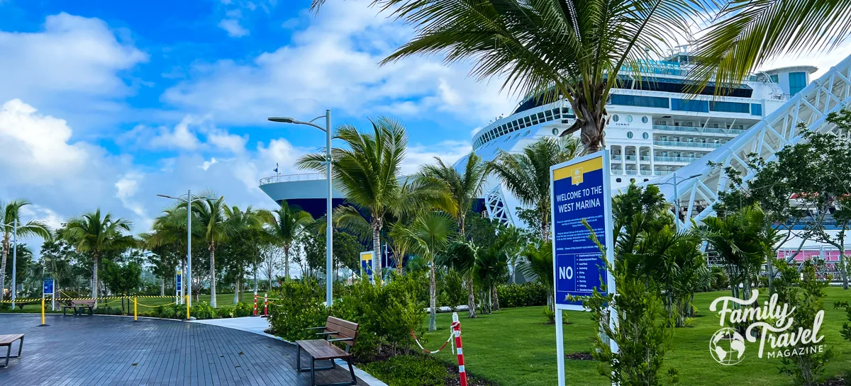 Celebrity summit docked at the Nassau West Marina with palm trees in the foreground