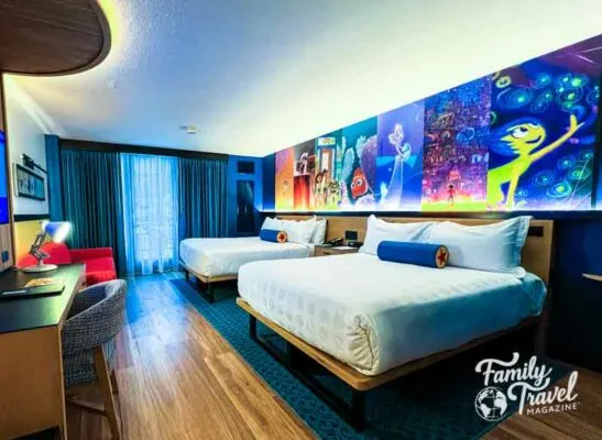 Room at Pixar Place Hotel including two beds and colorful mural