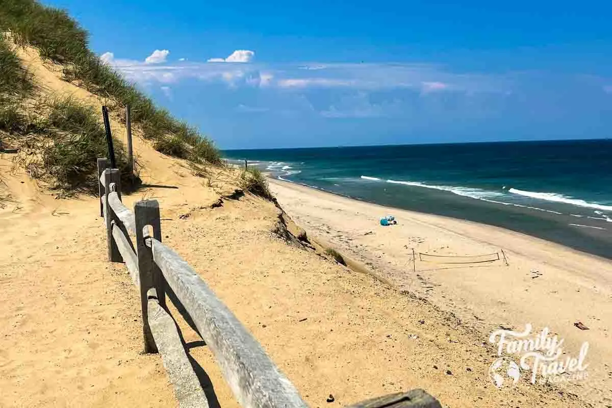 Beach dune with fence above beach