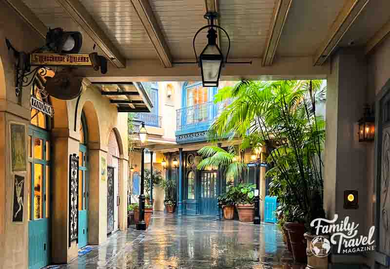 Shops and buildings in New Orleans Square in the rain