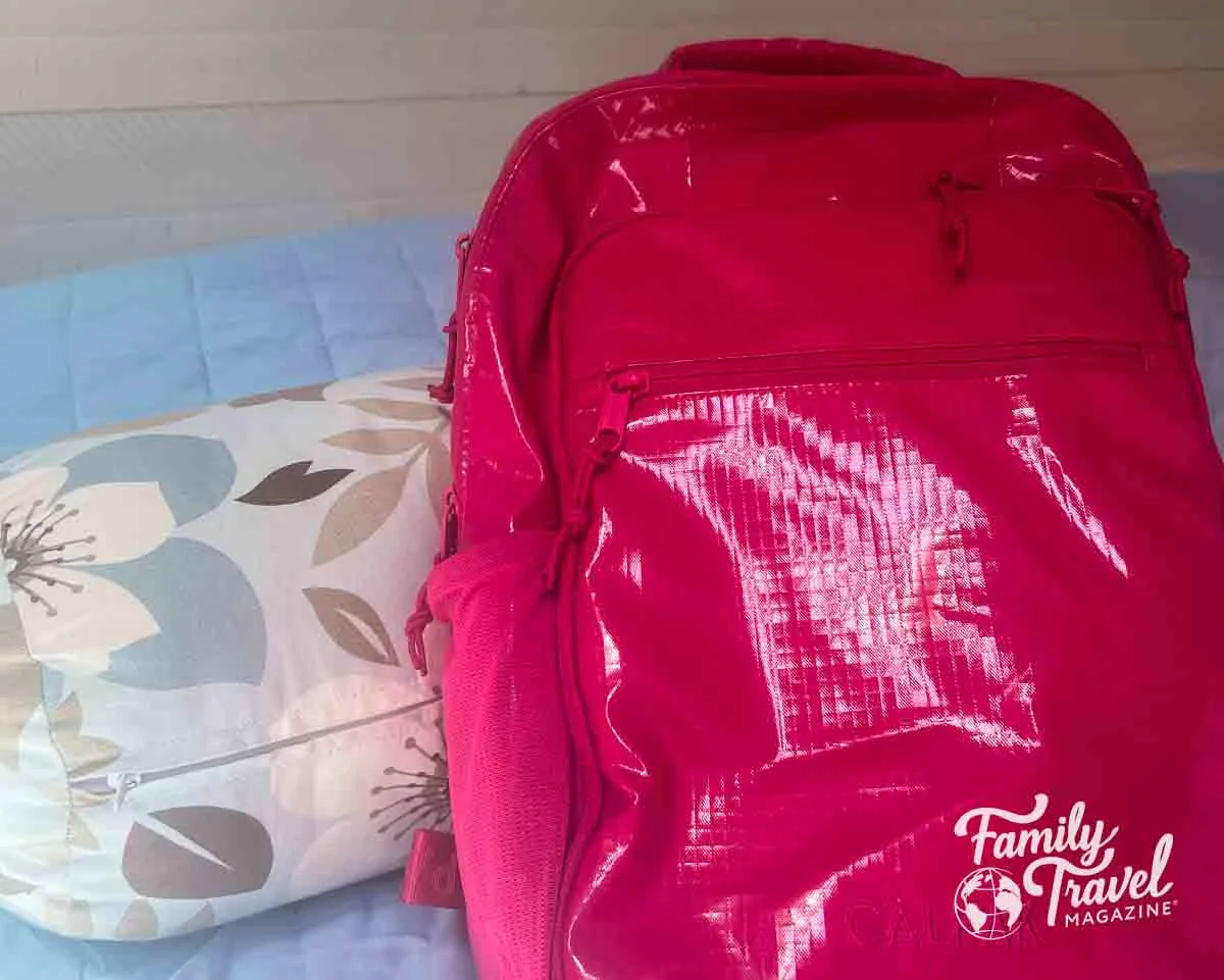 Pink backpack on bed