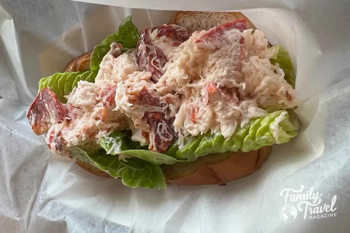 Lobster roll with mayo on a bed of lettuce
