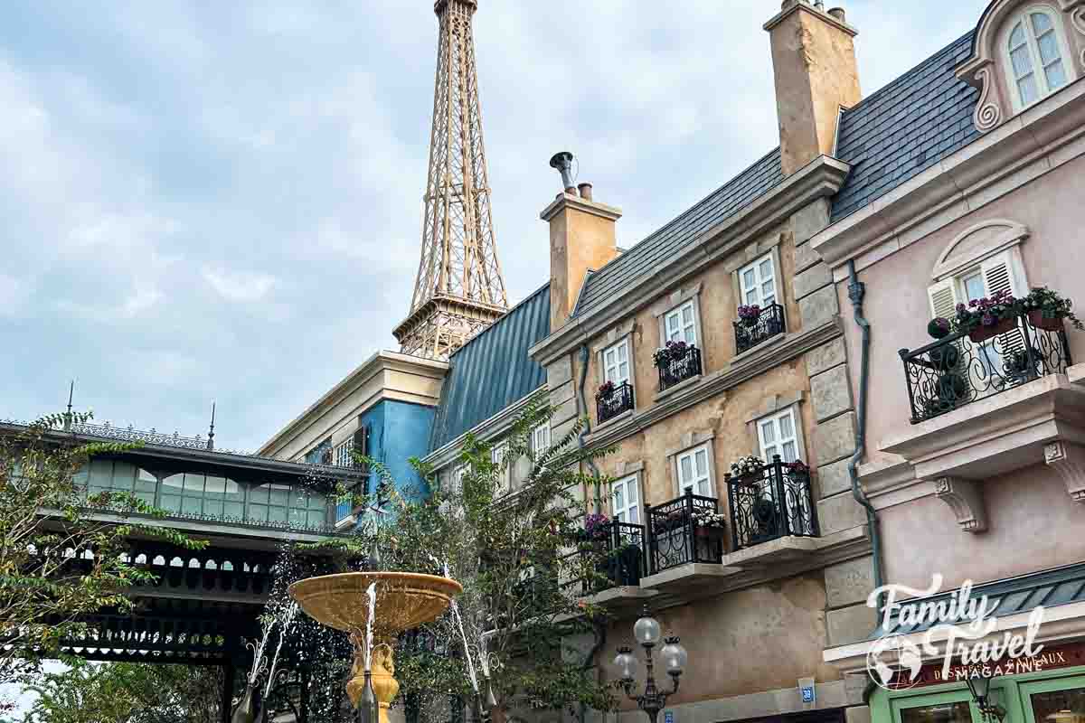 France pavilion in EPCOT with statue, Eiffel Tower and buildings 