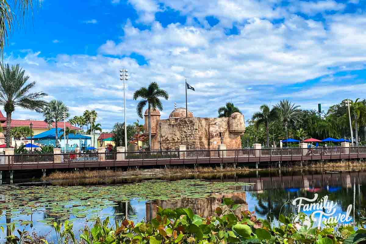 Caribbean Beach Pirate pool at a distance with water in foreground