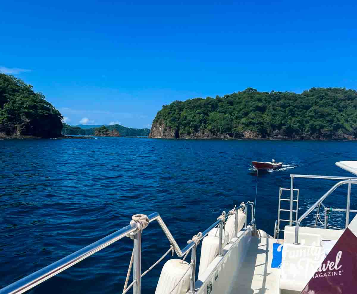 View from catamaran of Pacific Ocean with tender boat