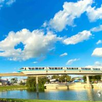 Monorail running by EPCOT with Spaceship Earth in the distance