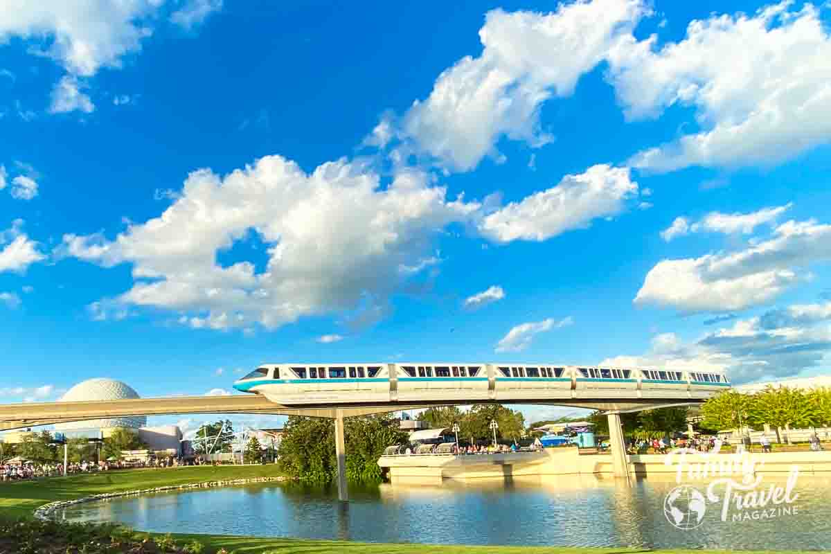 Monorail running by EPCOT with Spaceship Earth in the distance