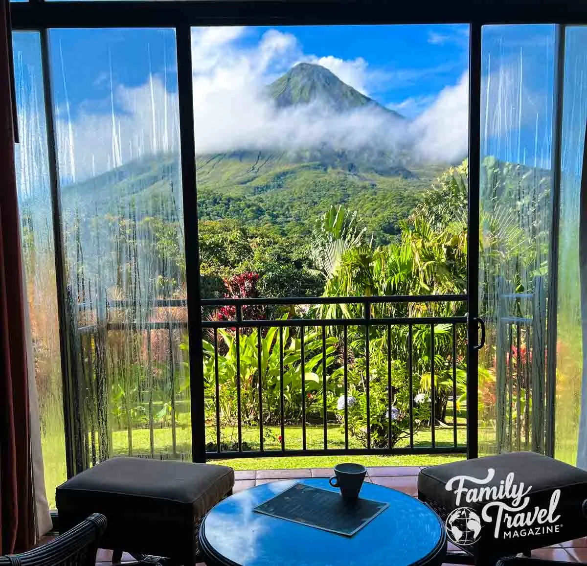 Arenal Volcano view from hotel room with greenery in foreground