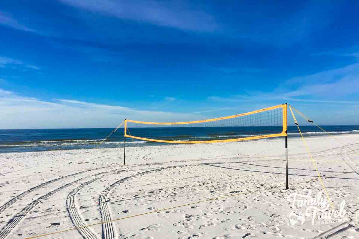 Volleyball net on white sand beach