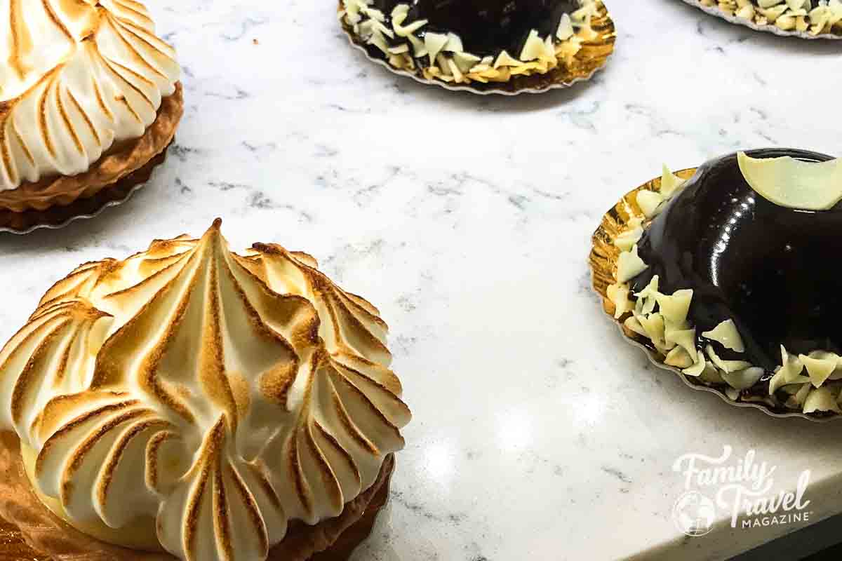 Meringue and chocolate pastries on counter