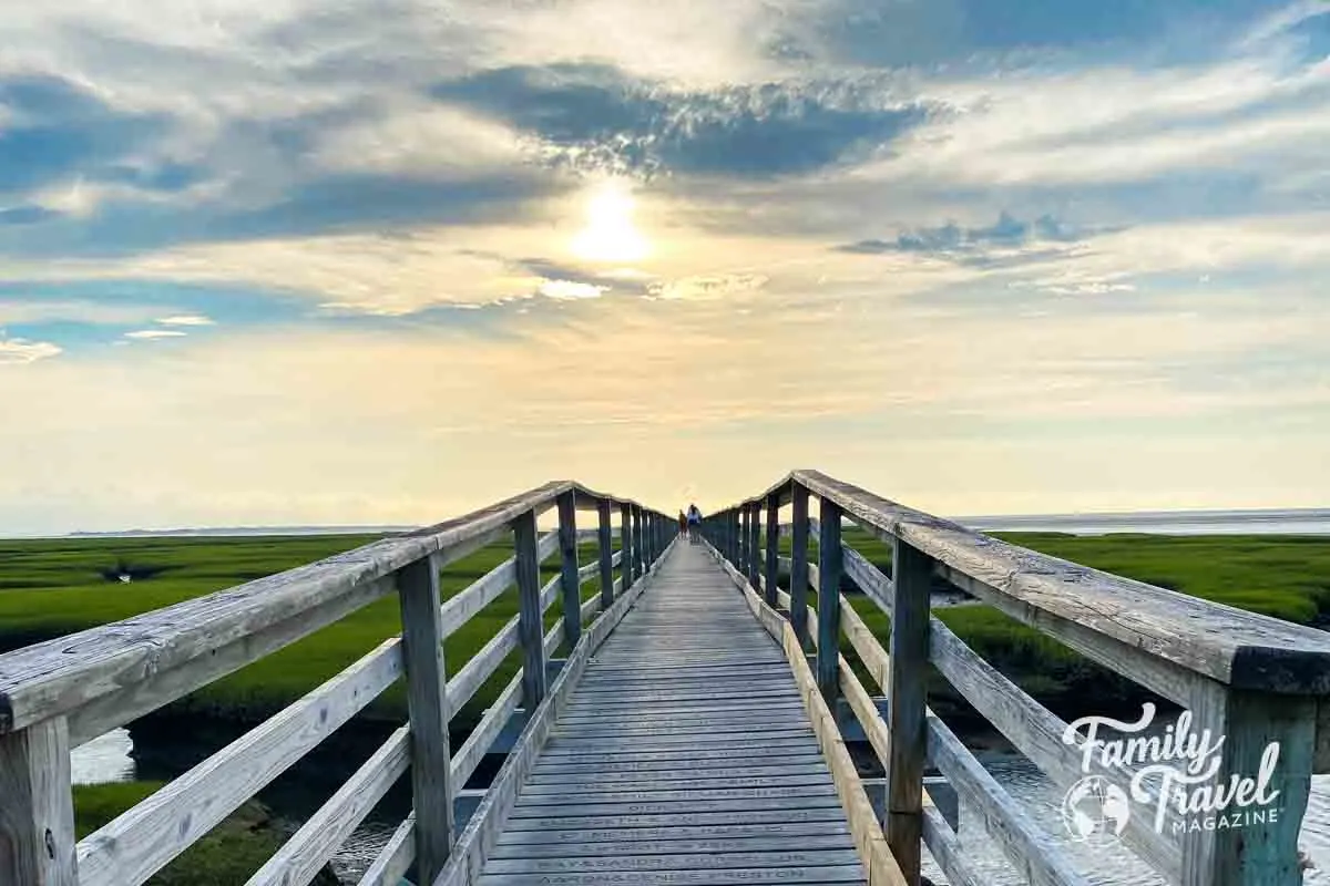 Boardwalk over marsh at sunset