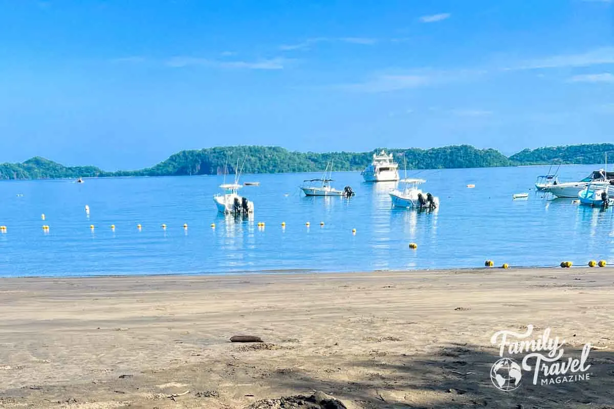 Beach with boats in water