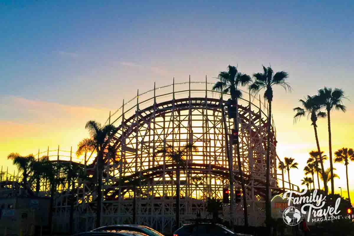 Back of coaster at sunset with palm trees