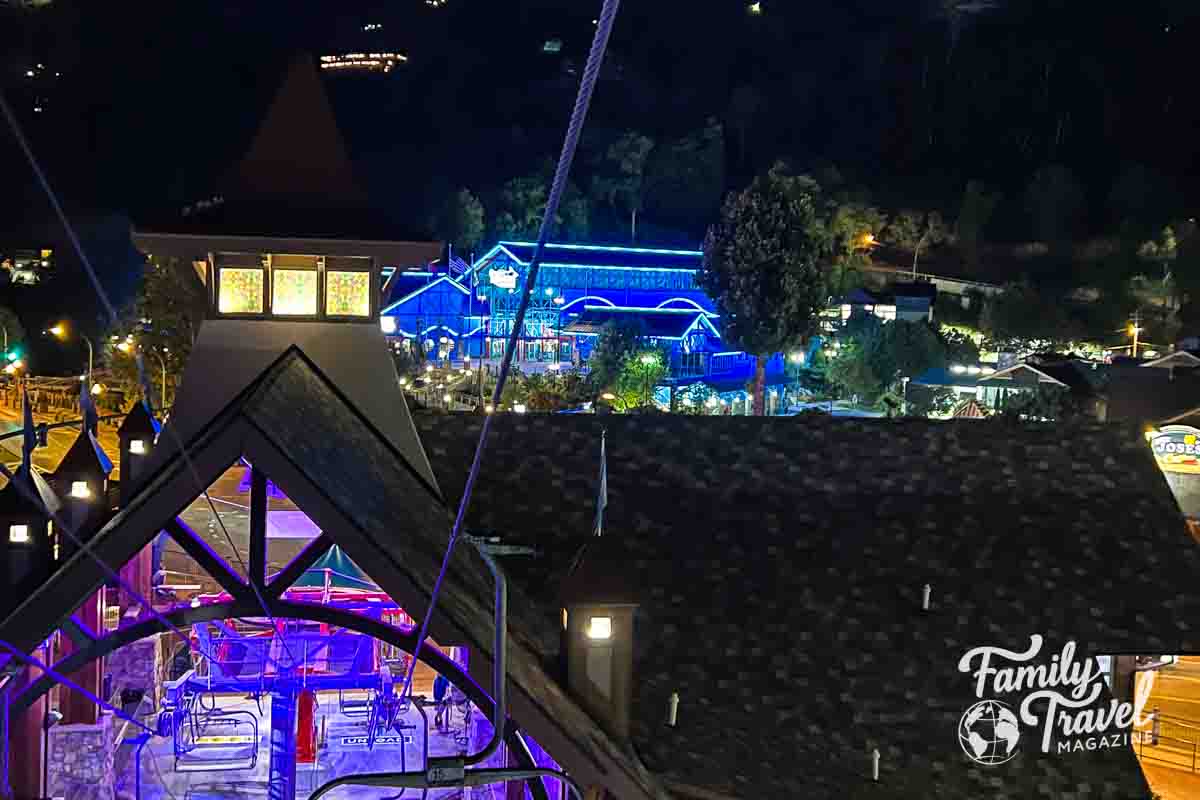 view of aquarium lit in blue from the chair lift 