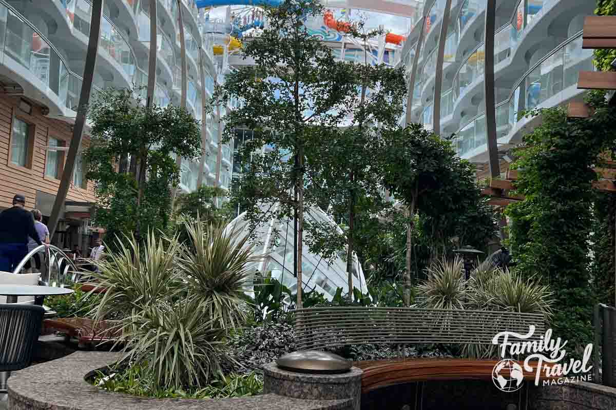 Central Park on Utopia of the Seas with trees and greenery surrounded by staterooms