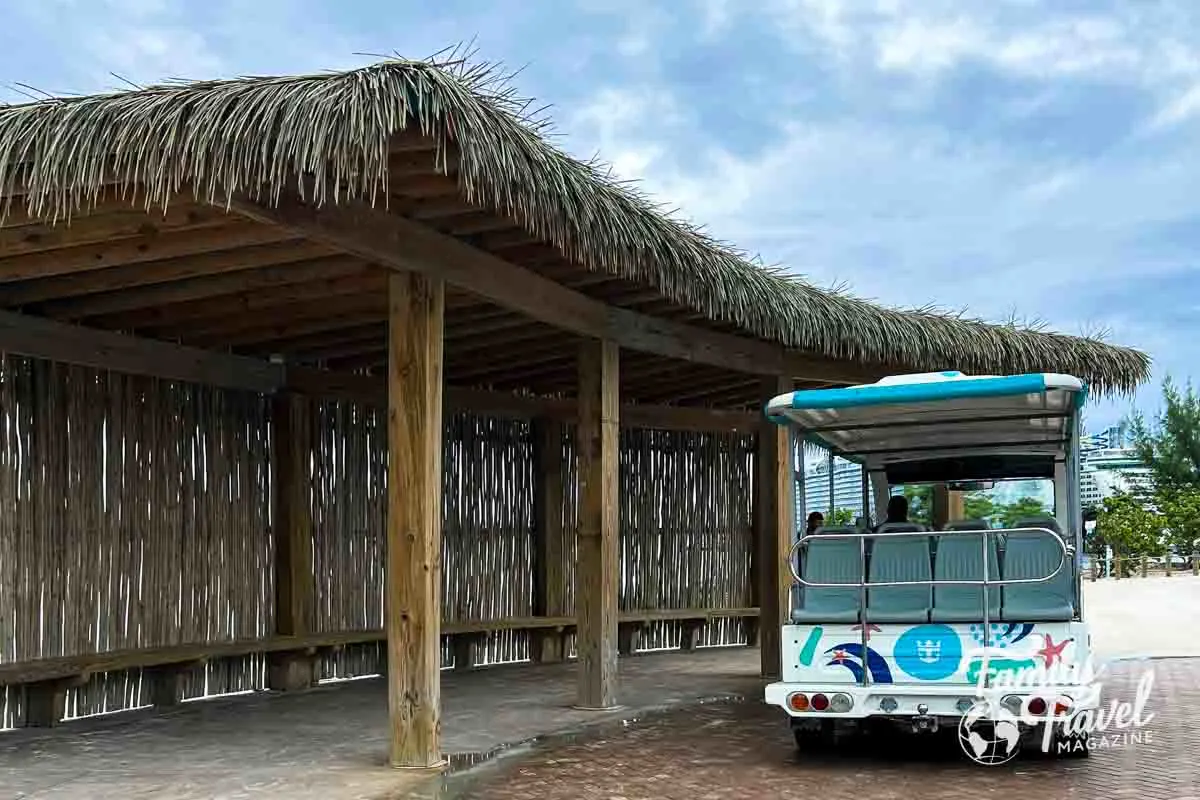 Tram parked at waiting area hut. 