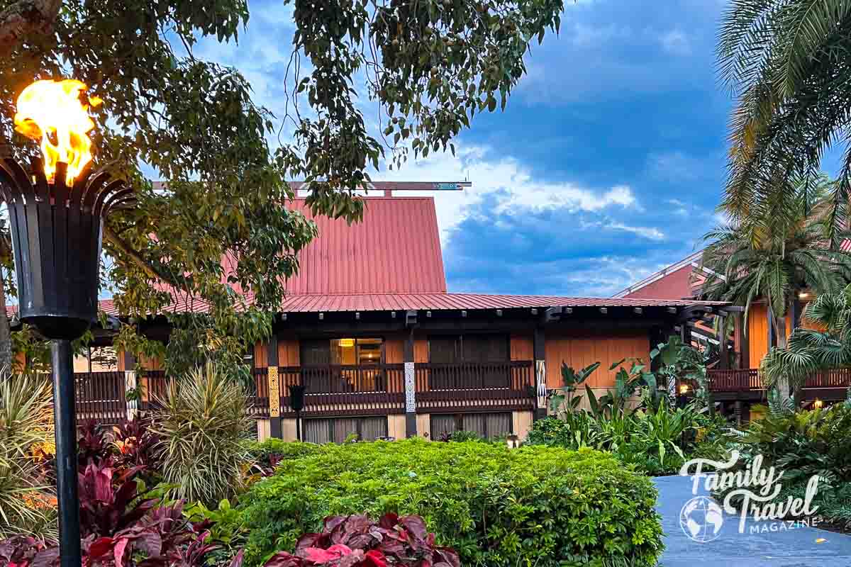 Polynesian building with trees and tiki light