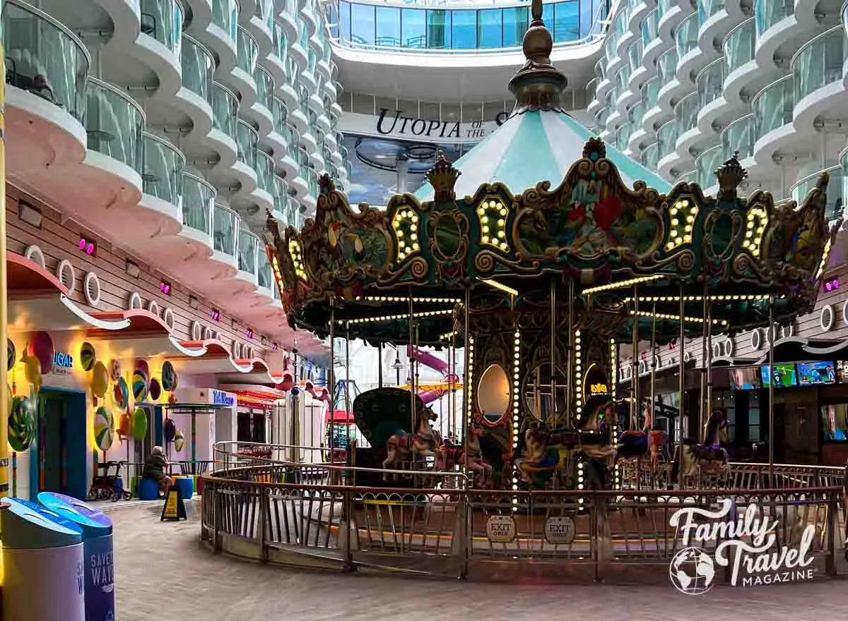 Boardwalk area of Utopia of the Seas with a carousel