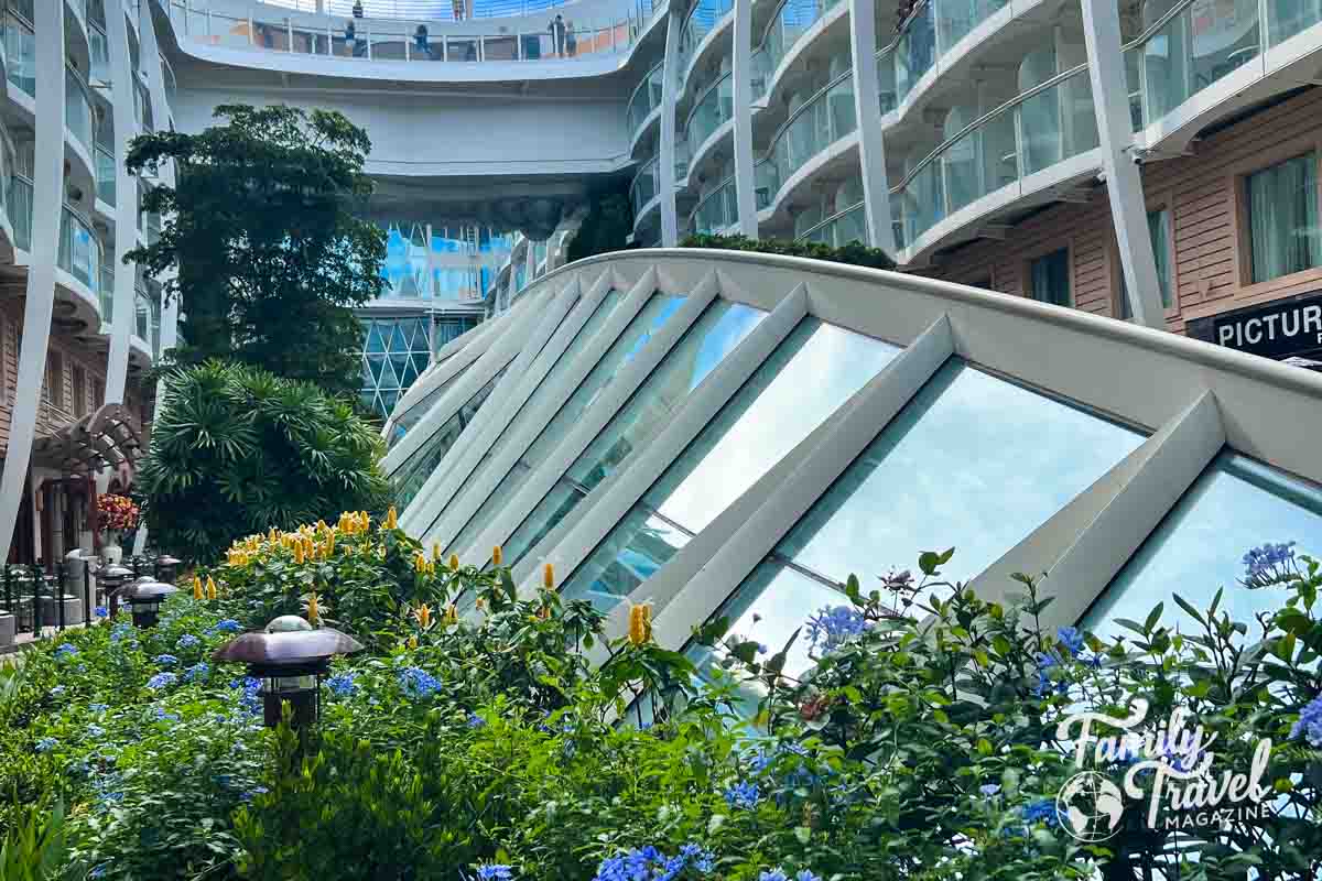 plants and large glass structure on board Allure of the Seas