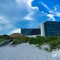 Exterior of the Hilton Hotel from the beach with a path leading to the hotel