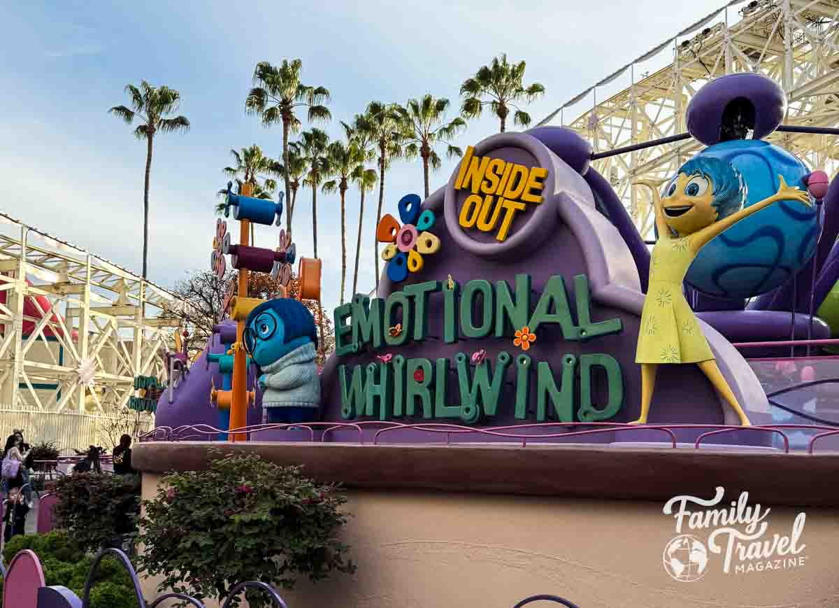 Inside Out Emotional Whirlwind character sign with Incredicoaster and palm trees in the background