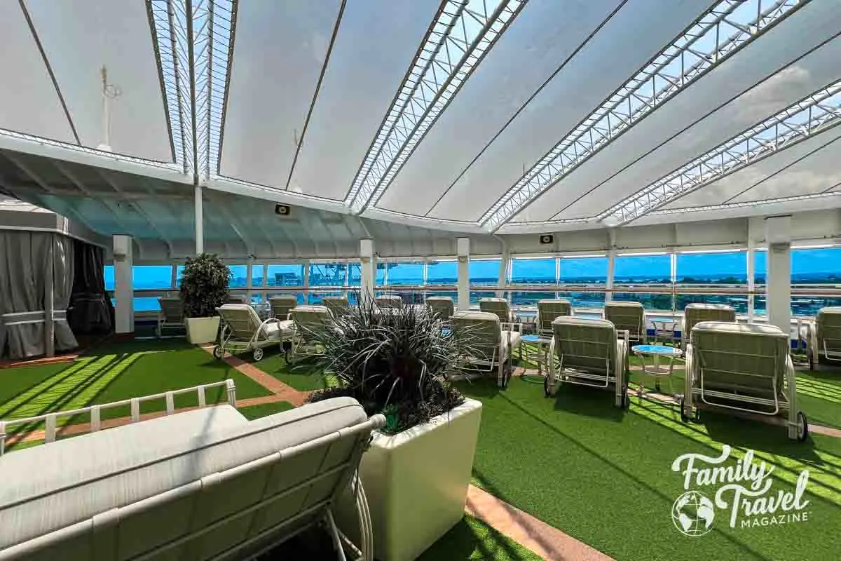 Covered sanctuary area with lounge chairs and astroturf floor