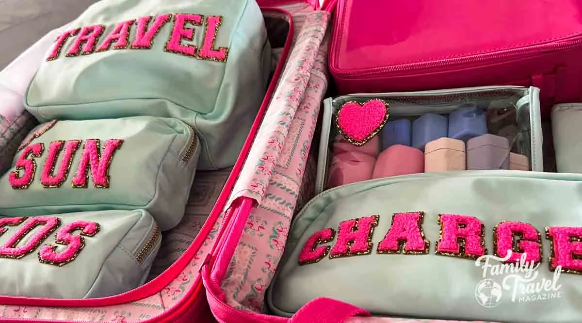 Aqua and pink pouches in a suitcase 